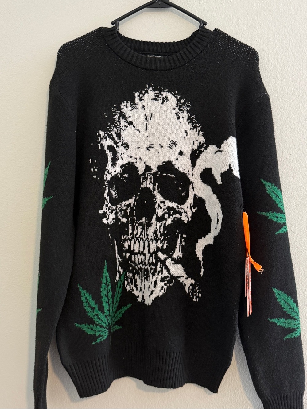 Men's Black Skull Graphic Knit Sweater with Green Leaf Accents